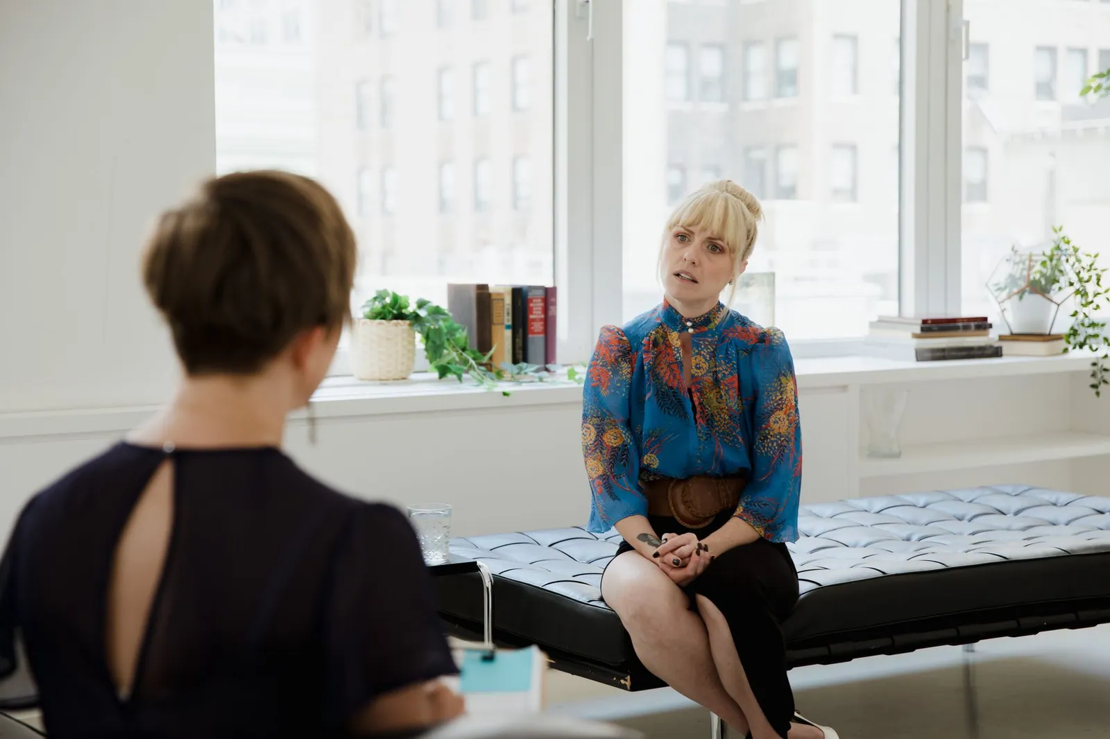 A coach working through figures with a client